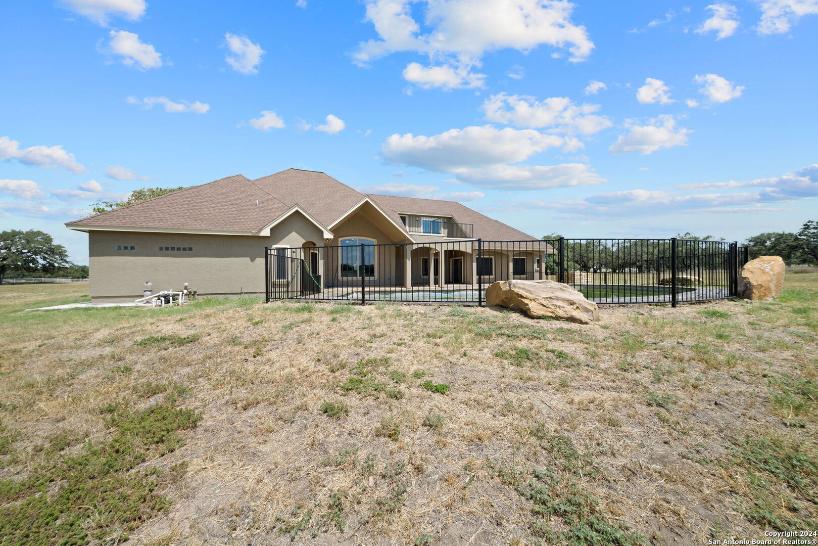 3022 Interstate 35 Natalia, TX 78059 - Photo 40 of 49 a front view of a house with a yard