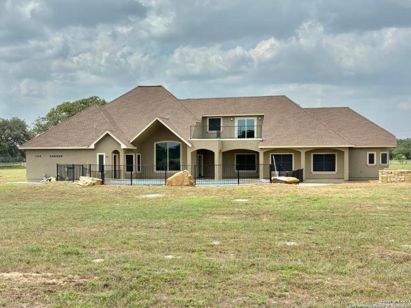 3022 Interstate 35 Natalia, TX 78059 - Photo 41 of 49 a front view of a house with a garden