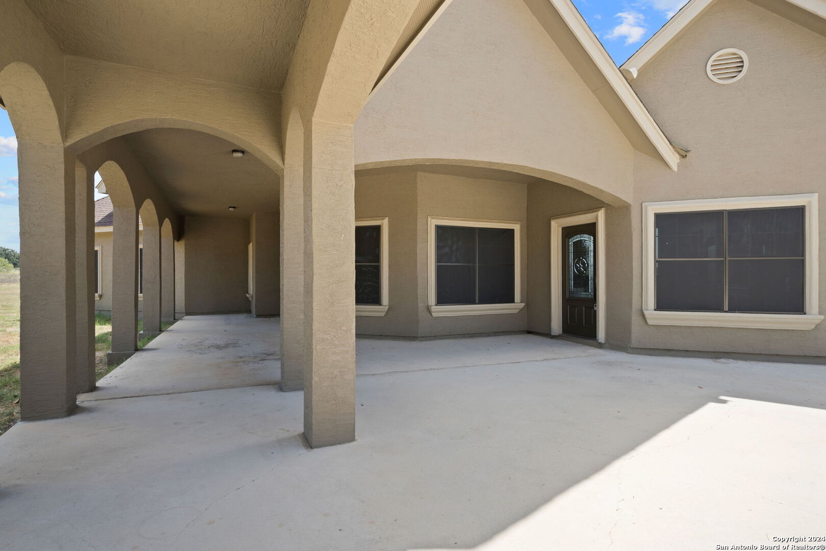 3022 Interstate 35 Natalia, TX 78059 - Photo 5 of 49 a view of a hallway with wooden shelves and a yard