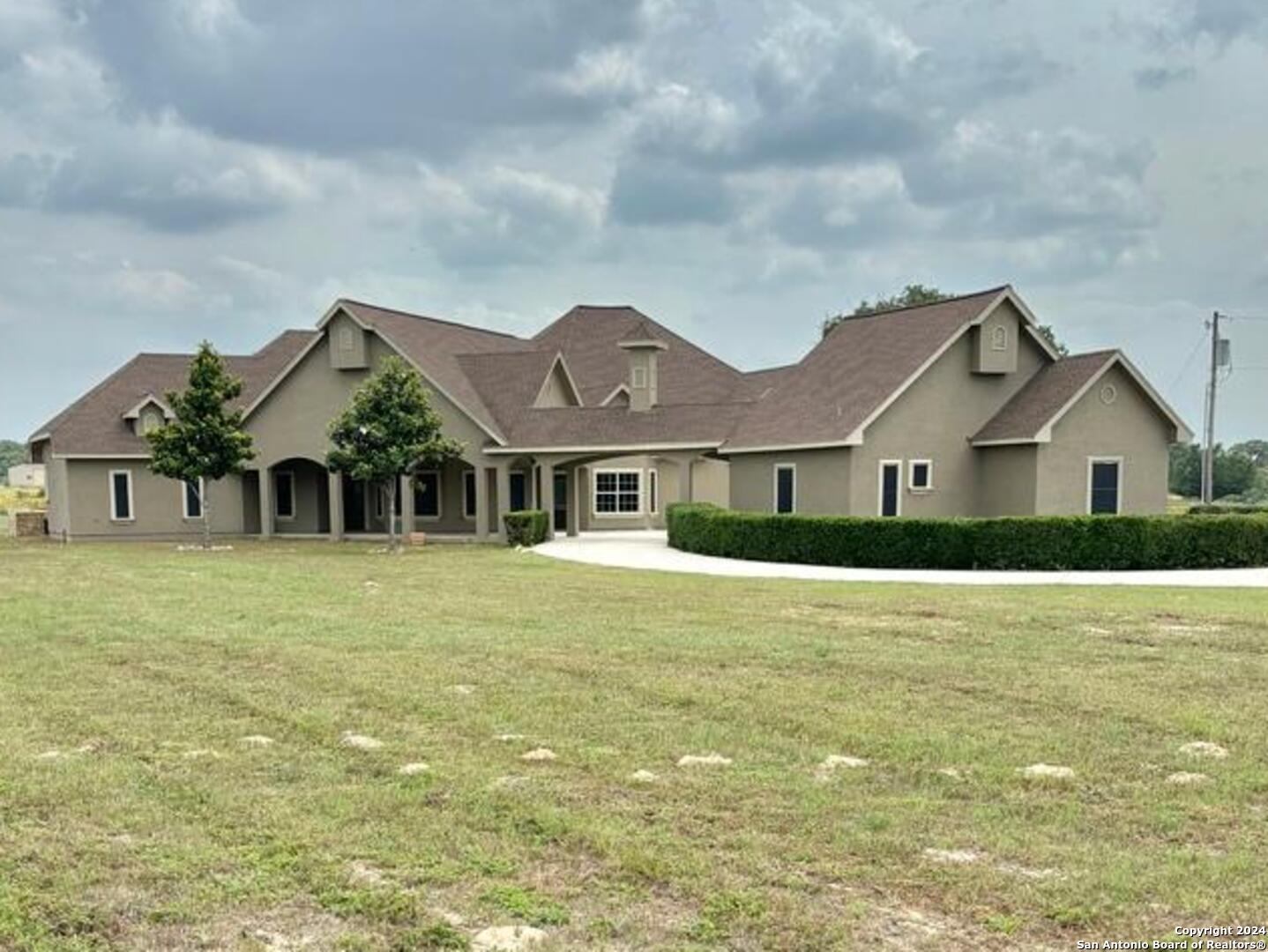 3022 Interstate 35 Natalia, TX 78059 - Photo 7 of 49 a front view of house with yard and green space