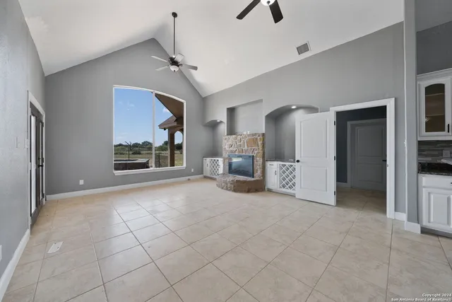 a view of a kitchen with a sink and a living room