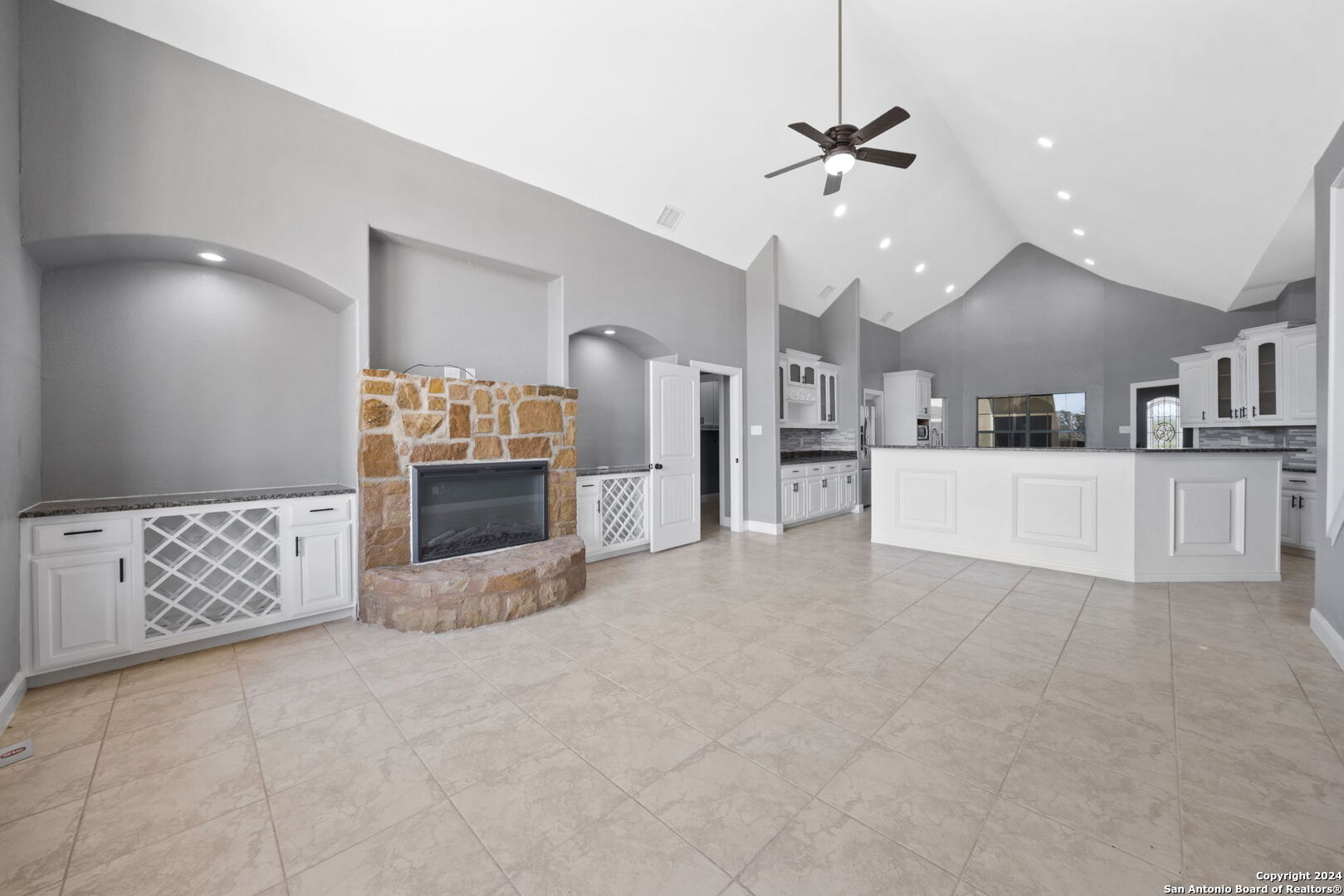3022 Interstate 35 Natalia, TX 78059 - Photo 10 of 49 a view of a kitchen with a sink and a living room