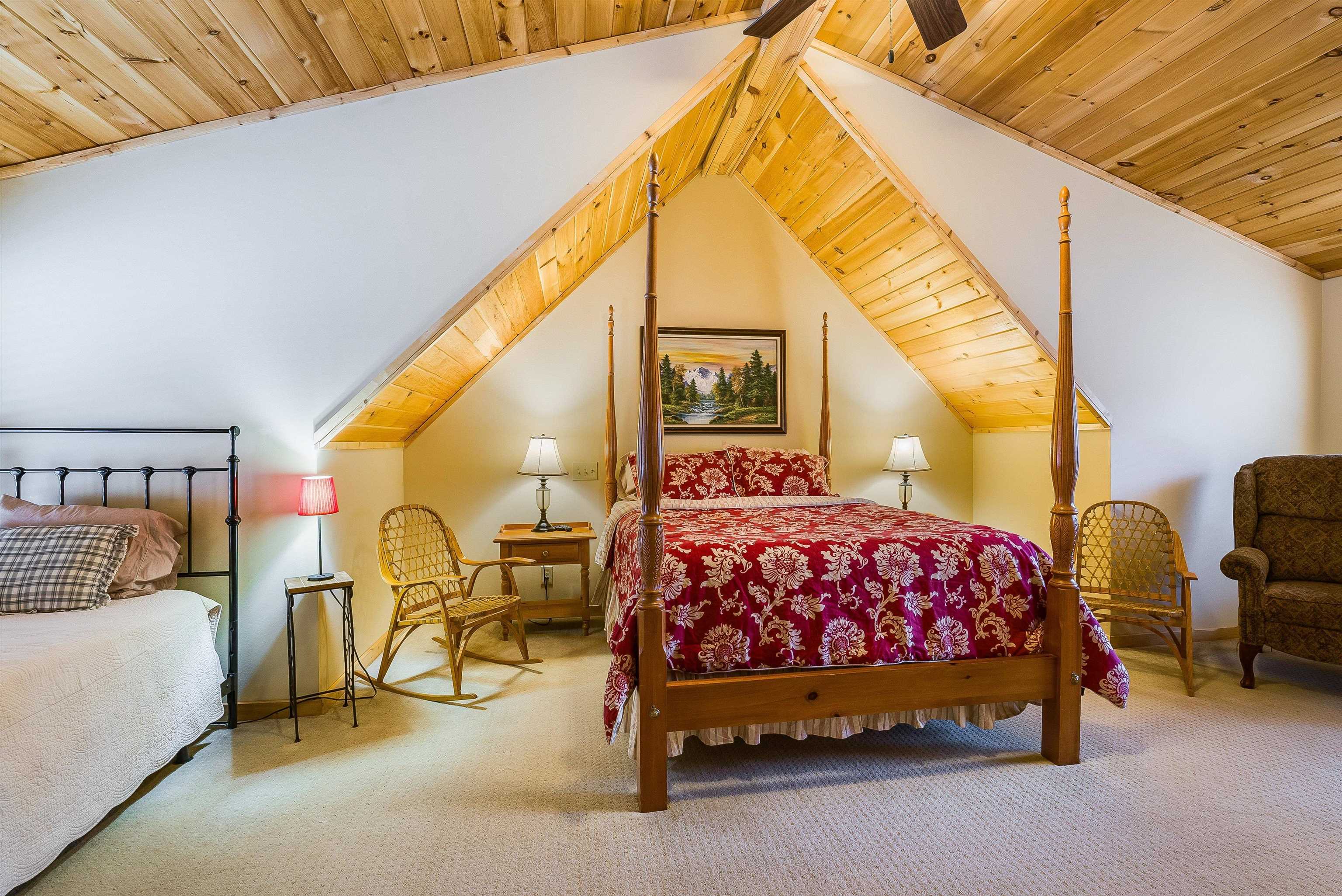 781 Rainier Road McGaheysville, VA 22840 - Photo 23 of 51 a bedroom with a bed a lamp and paintings on the wall