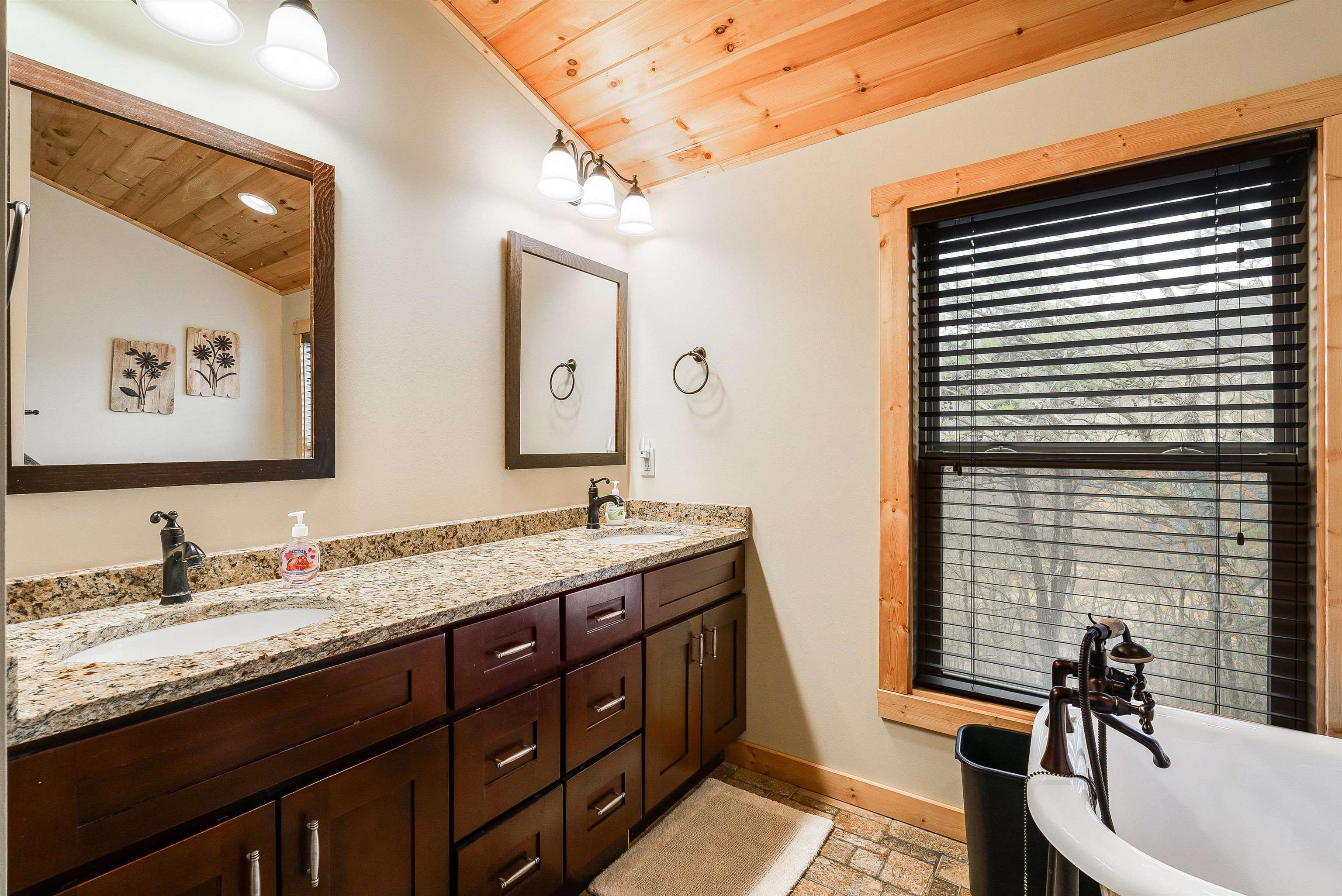 781 Rainier Road McGaheysville, VA 22840 - Photo 27 of 51 a spacious bathroom with a granite countertop sink and a large mirror