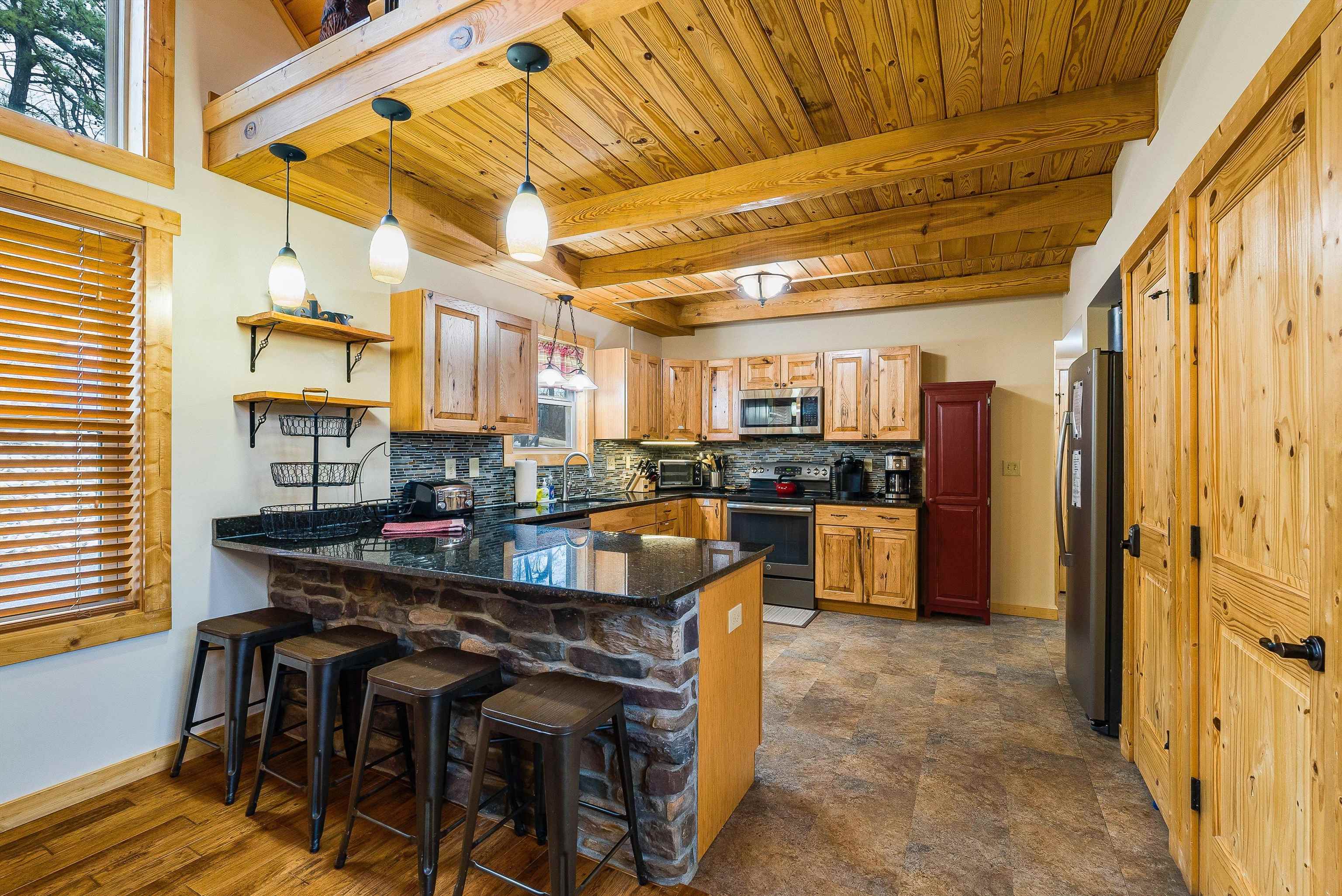 781 Rainier Road McGaheysville, VA 22840 - Photo 8 of 51 a kitchen with stainless steel appliances kitchen island granite countertop a table and chairs