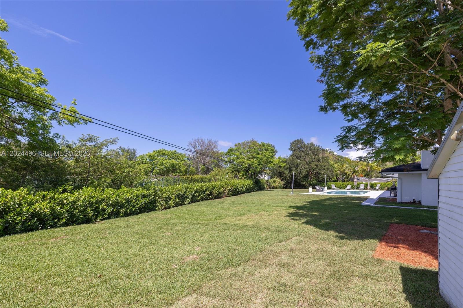 6875 North Cartee Road Palmetto Bay, FL 33158 - Photo 36 of 42 a view of a yard with an tree