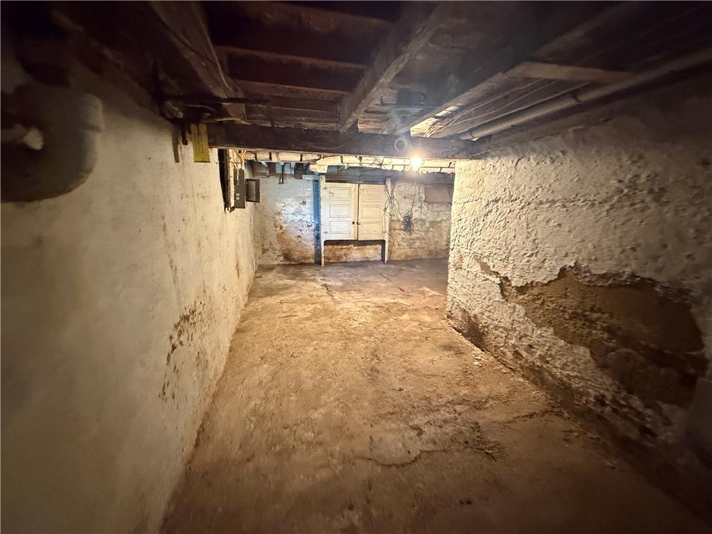 3051 Keystone Street Bethlehem, PA 18020 - Photo 17 of 18 A spacious unfinished basement with concrete flooring offers abundant storage potential.
