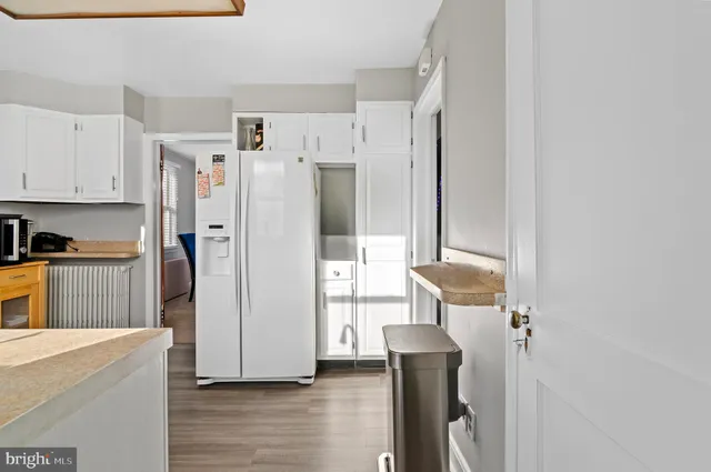 a kitchen with stainless steel appliances a refrigerator and a stove