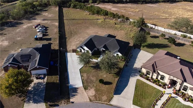 an aerial view of houses with outdoor space