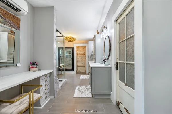 a bathroom with a sink a mirror and a bathtub