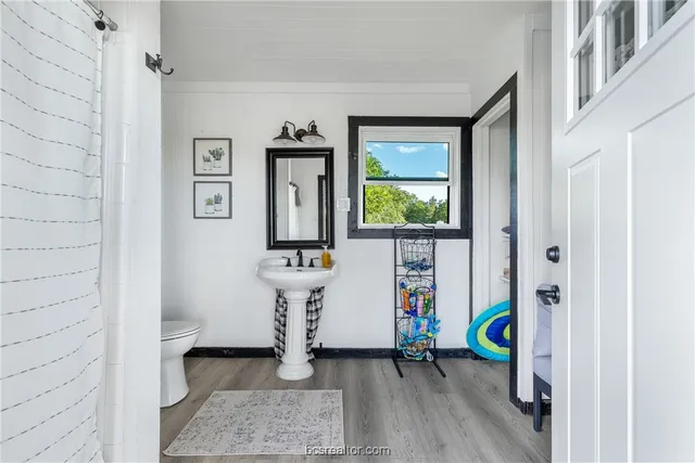 a view of an entryway with wooden floor
