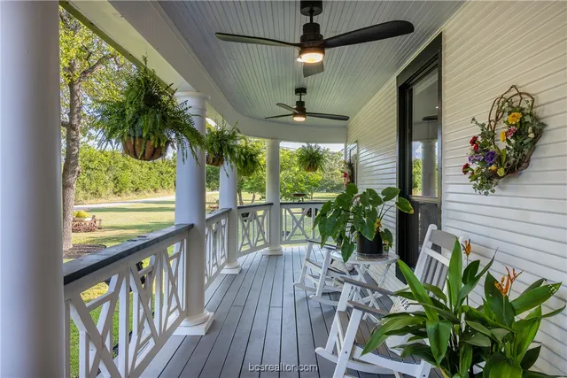 a view of a porch with wooden floor