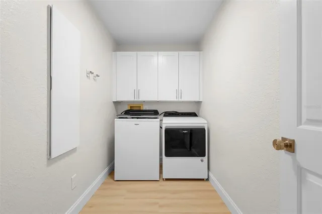 a view of storage and utility room with washer and dryer