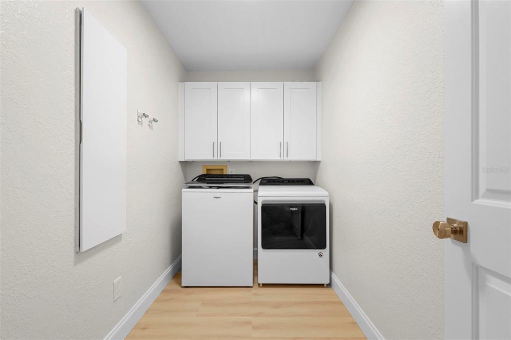 26 Laurianne Road DeBary, FL 32713 - Photo 20 of 41 a view of storage and utility room with washer and dryer