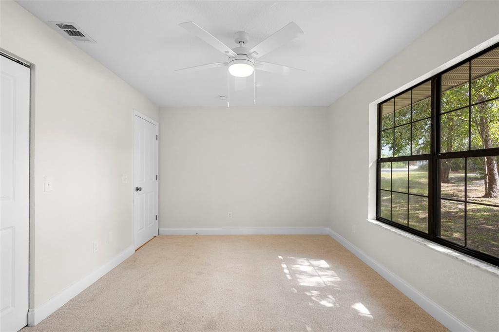 26 Laurianne Road DeBary, FL 32713 - Photo 27 of 41 wooden floor in an empty room with a window