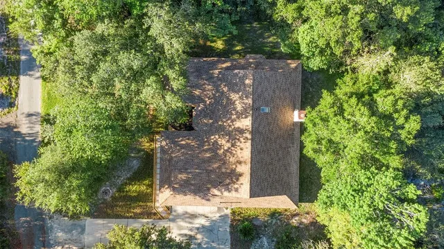front view of a house with a tree