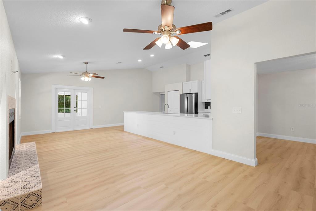26 Laurianne Road DeBary, FL 32713 - Photo 8 of 41 a view of a livingroom with a ceiling fan window and wooden floor