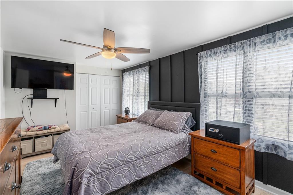 334 Orchard Street Springdale, PA 15144 - Photo 14 of 25 a bedroom with a bed and flat screen tv