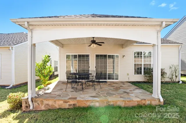 a front view of house with yard outdoor seating and barbeque oven