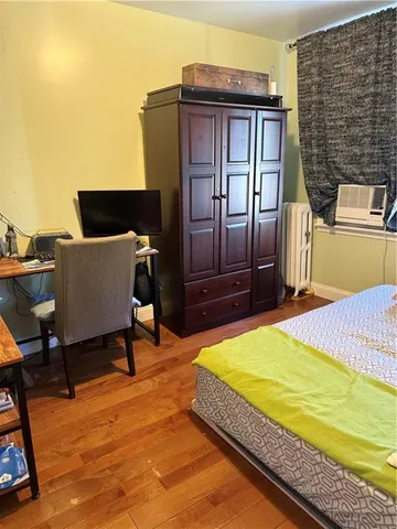 a bedroom with a bed and furniture