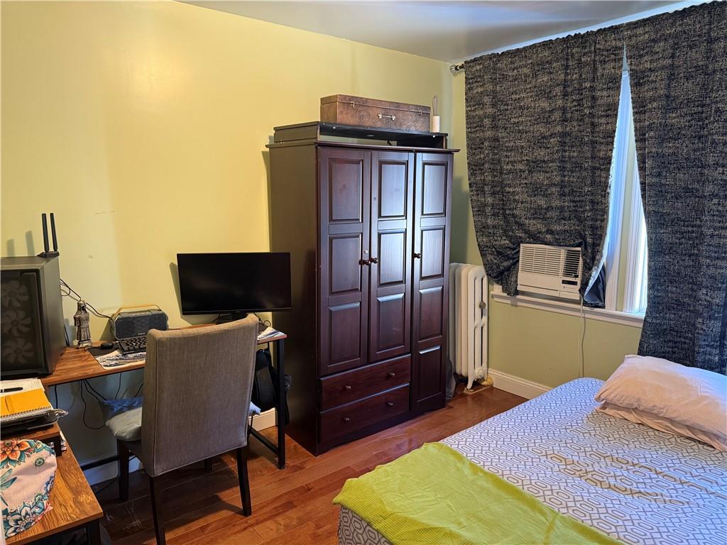 3016 Brighton 3rd Street Brooklyn, NY 11235 - Photo 17 of 21 a bedroom with a bed and a television