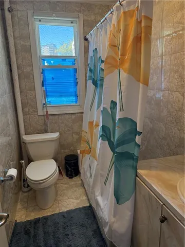 a bathroom with a toilet and a sink