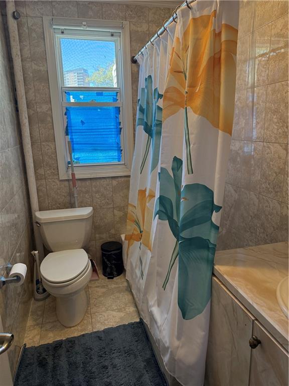 3016 Brighton 3rd Street Brooklyn, NY 11235 - Photo 21 of 21 a bathroom with a toilet and a sink