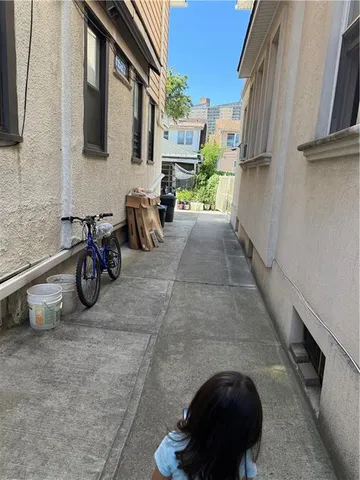 a view of a chairs and table in the balcony