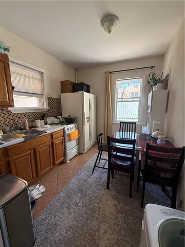 a room with furniture a piano and a window