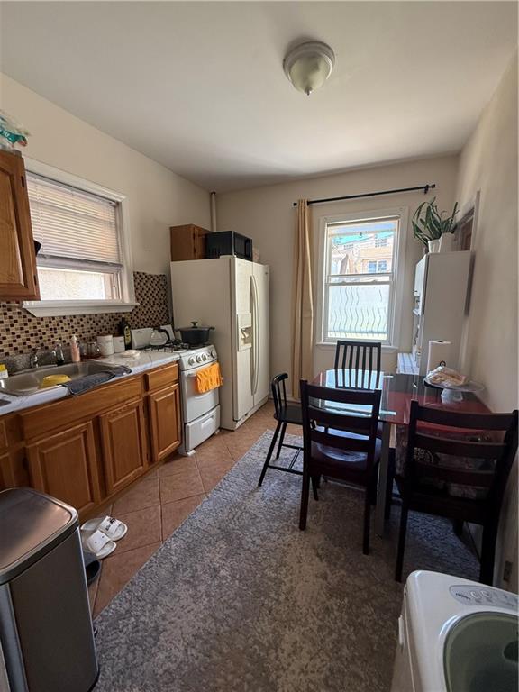 3016 Brighton 3rd Street Brooklyn, NY 11235 - Photo 6 of 21 a room with furniture a piano and a window