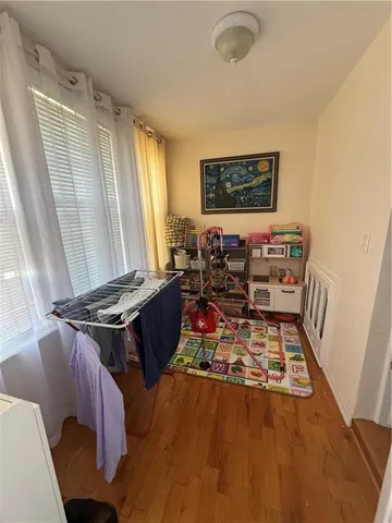 a living room with furniture rug and a window
