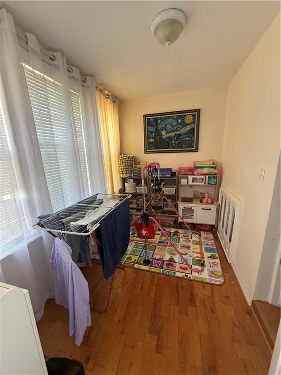 3016 Brighton 3rd Street Brooklyn, NY 11235 - Photo 9 of 21 a living room with furniture rug and a window