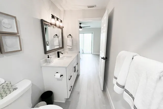 a bathroom with a sink a mirror and shower