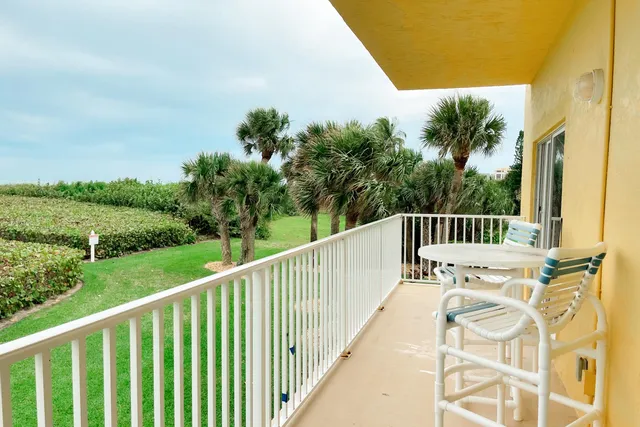 a view of balcony with furniture