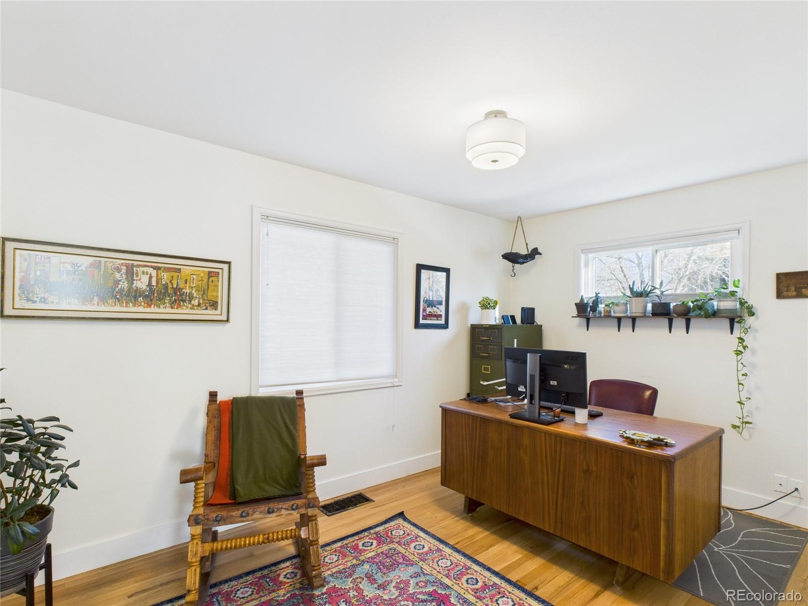 1360 South Ivy Way Denver, CO 80224 - Photo 11 of 23 a living room with furniture and a window