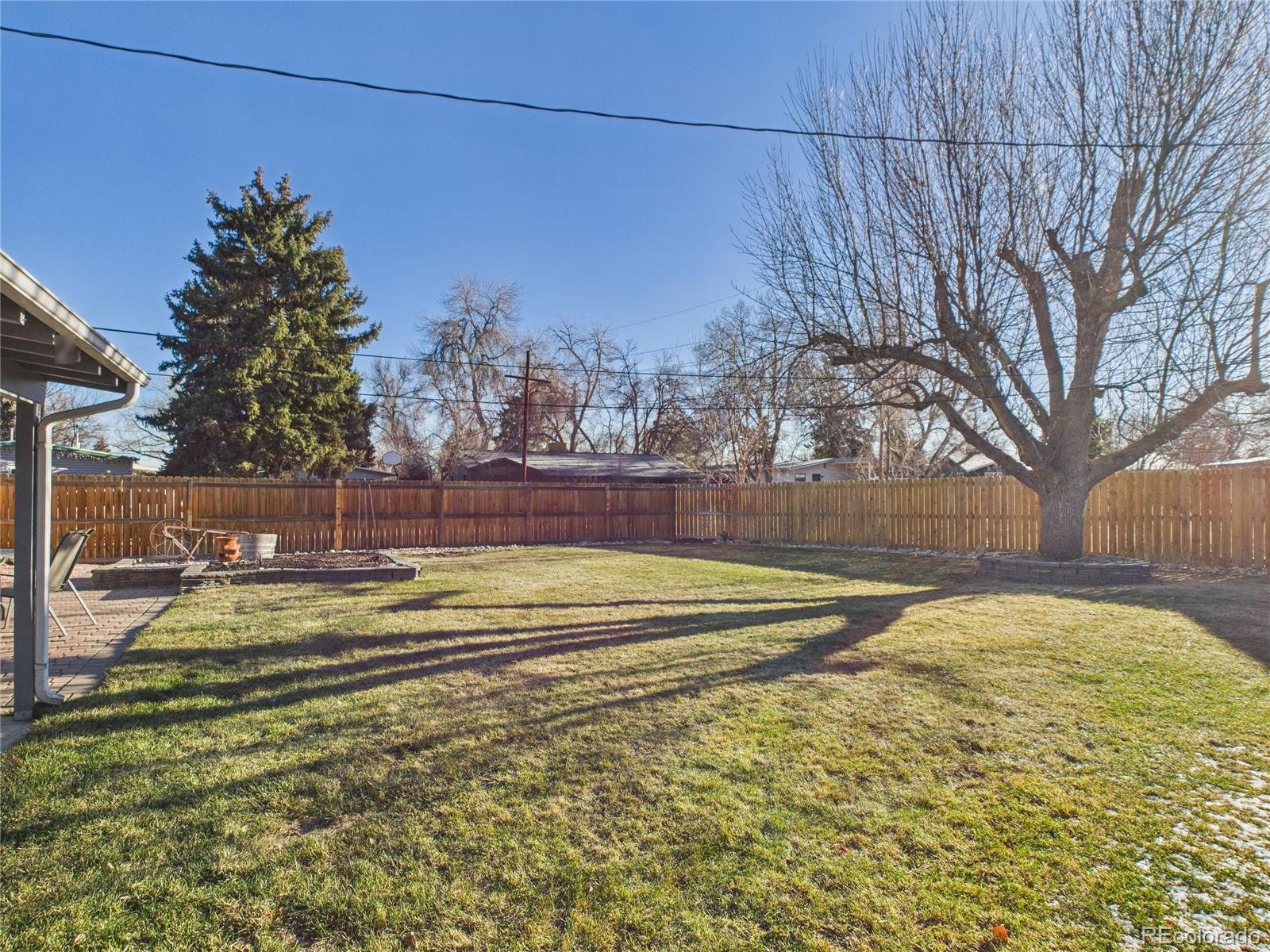 1360 South Ivy Way Denver, CO 80224 - Photo 19 of 23 a view of a swimming pool with an outdoor space and seating area
