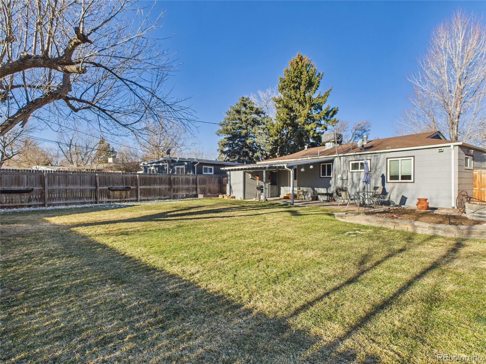 1360 South Ivy Way Denver, CO 80224 - Photo 20 of 23 a view of a house with swimming pool