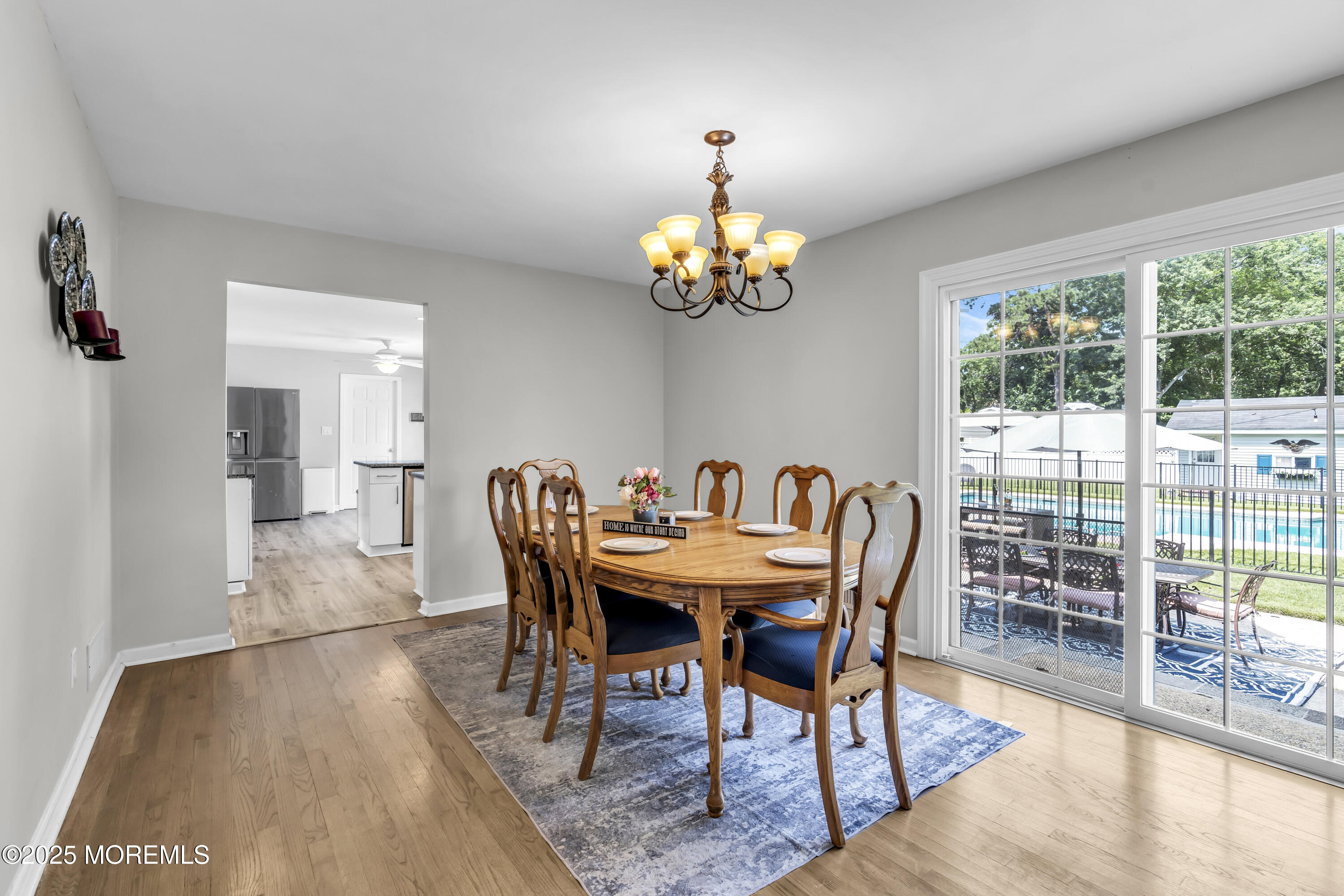 40 South Westfield Road Howell, NJ 07731 - Photo 11 of 36 a view of a dining room with furniture wooden floor and chandelier