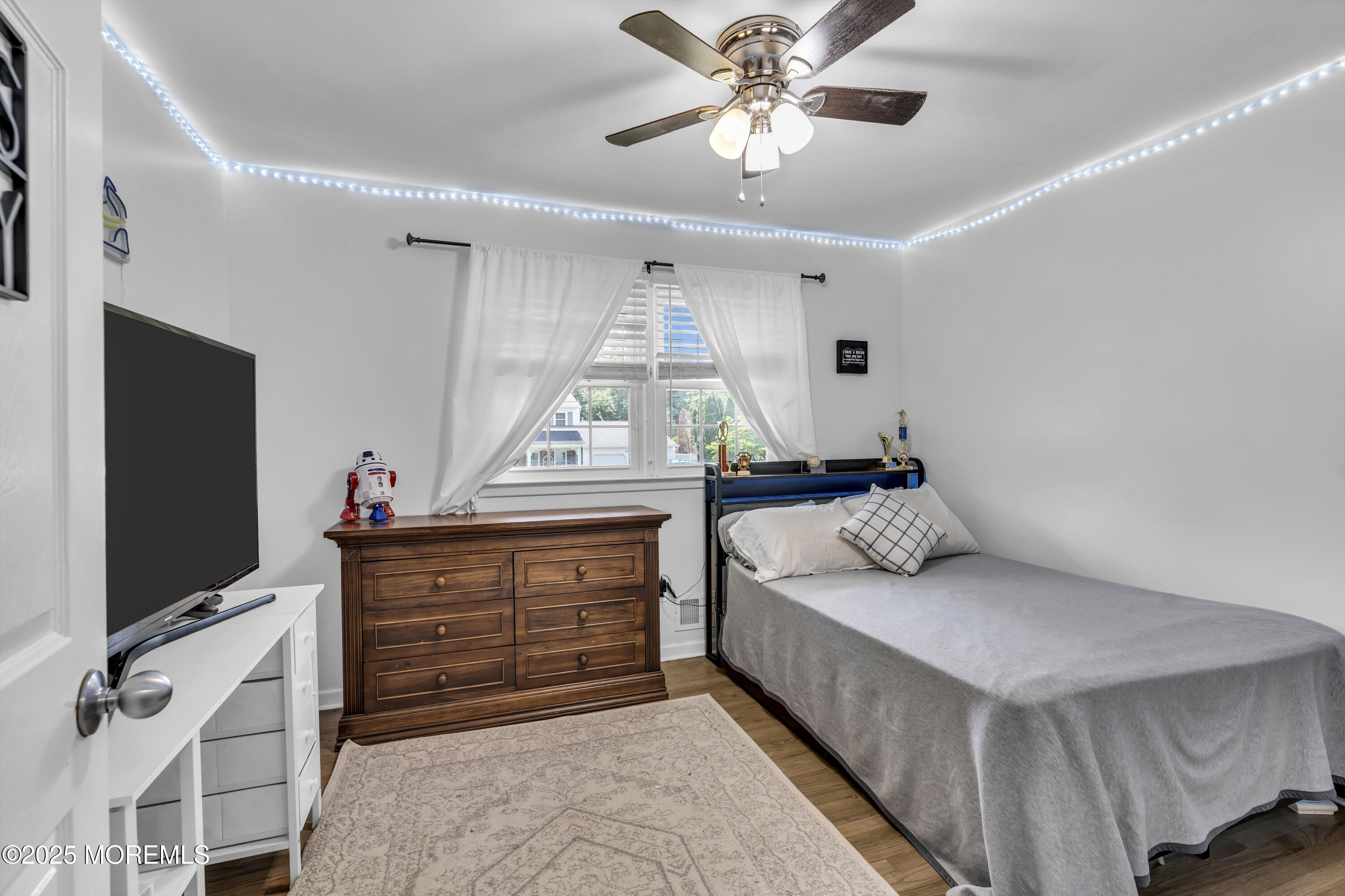40 South Westfield Road Howell, NJ 07731 - Photo 20 of 36 a bedroom with a bed and a flat screen tv