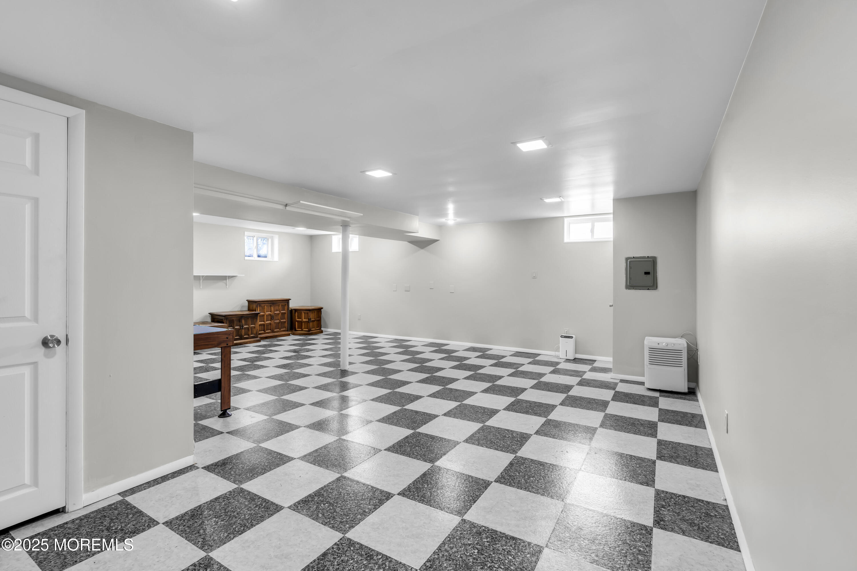 40 South Westfield Road Howell, NJ 07731 - Photo 27 of 36 a view of a hallway with a black white checkered floor
