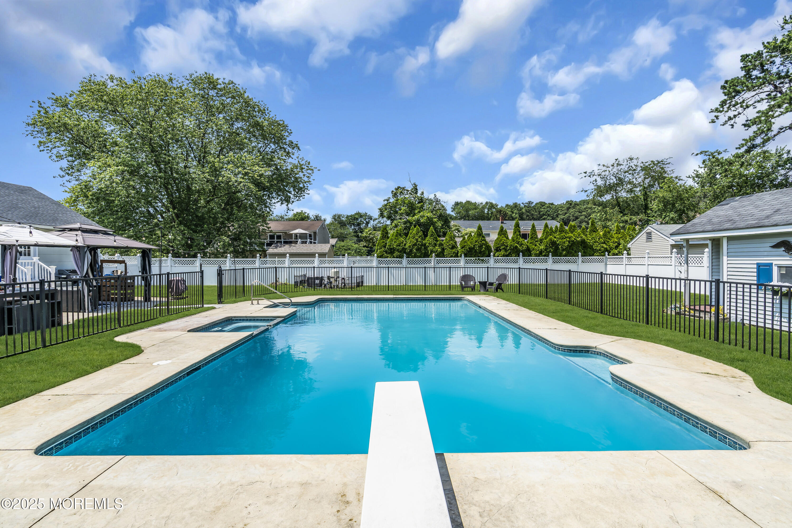 40 South Westfield Road Howell, NJ 07731 - Photo 6 of 36 a view of a house with swimming pool and sitting area