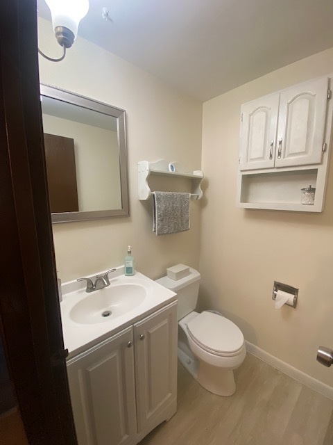 966 North Rohlwing Road, Unit GB Addison, IL 60101 - Photo 12 of 12 a bathroom with a toilet a sink and mirror