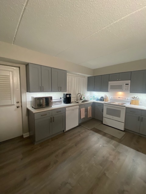 966 North Rohlwing Road, Unit GB Addison, IL 60101 - Photo 3 of 12 a kitchen with white cabinets and white appliances