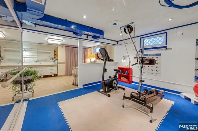 a bedroom with furniture and wooden floor