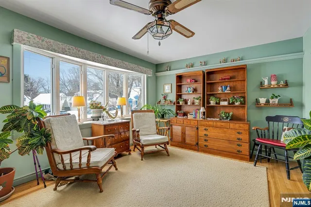 a dining room with furniture water view and a large window