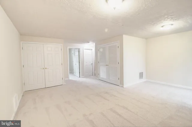 a view of a park with iron fence