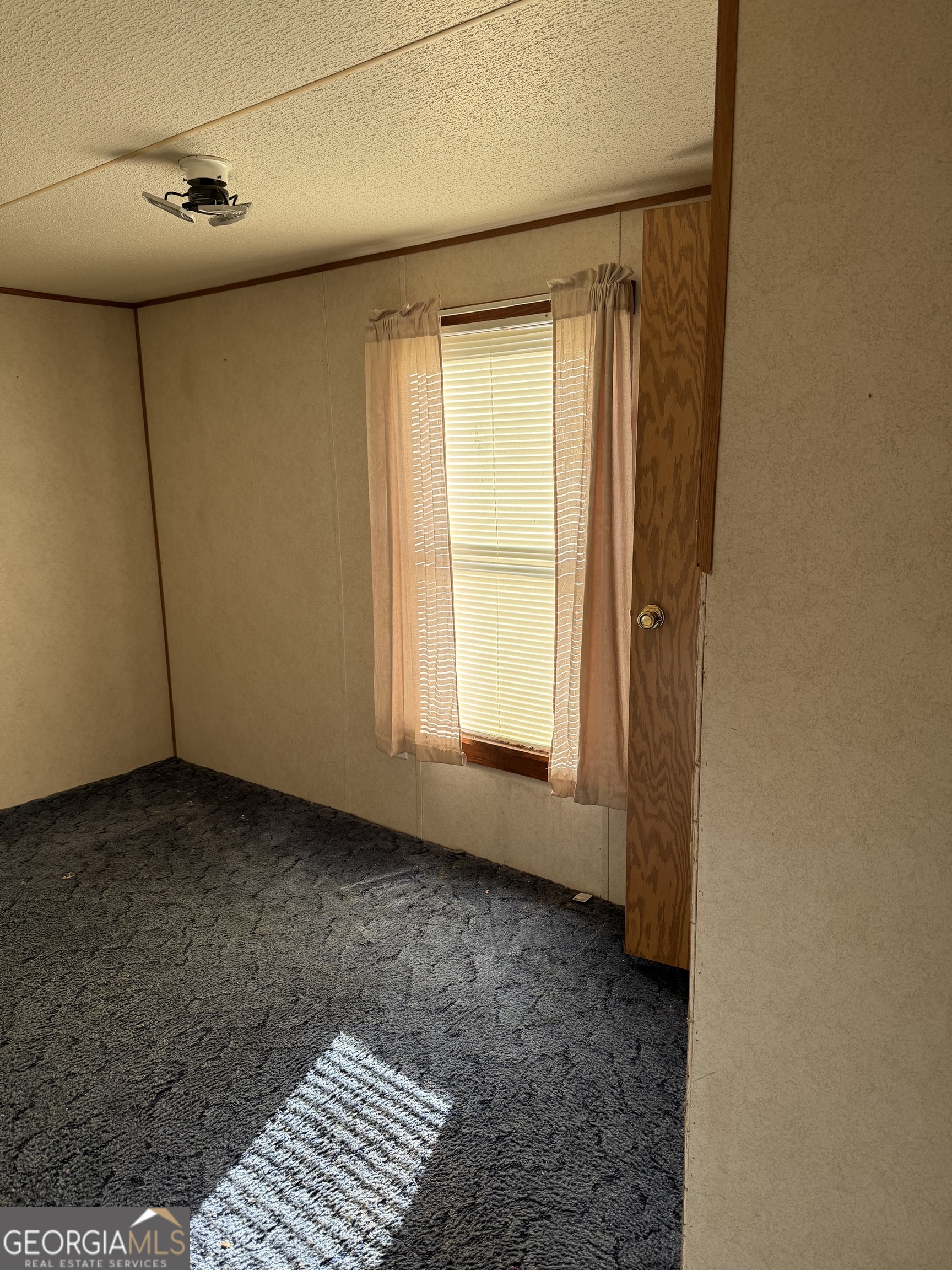 354 Ridgeview Circle Morganton, GA 30560 - Photo 4 of 10 a view of an empty room with a window