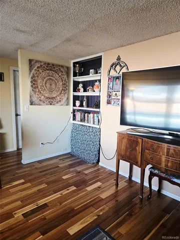 a kitchen with a stove a sink and a refrigerator