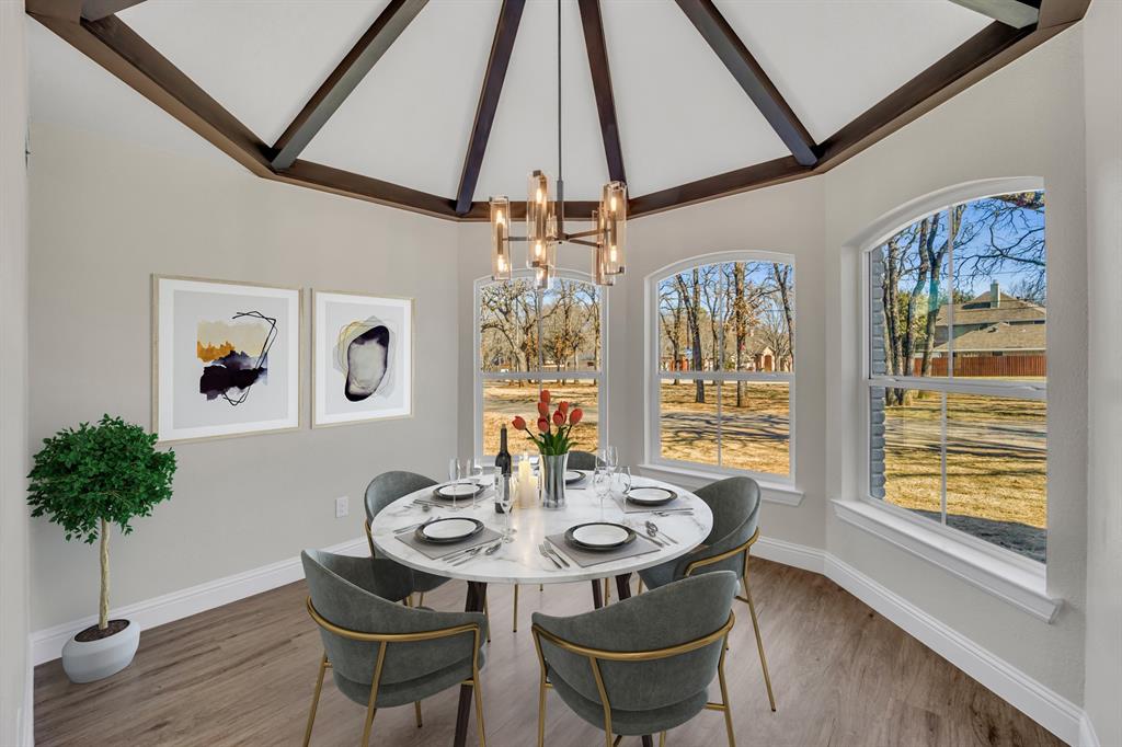 7004 Ledbetter Road Arlington, TX 76001 - Photo 11 of 39 a view of a dining room with furniture window and wooden floor