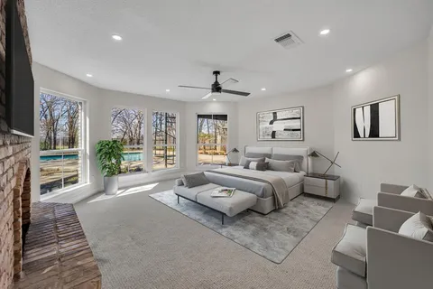 a living room with furniture large window and flat screen tv